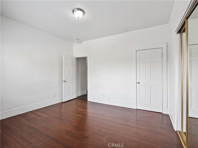 117 N Toluca St, Los Angeles, CA 90026 - unfurnished bedroom featuring wood finished floors and baseboards