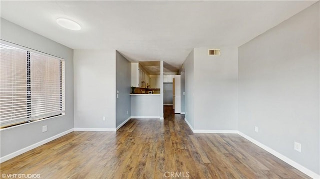 9020 Newport Ave Unit 17, Fontana, CA 92335 - unfurnished living room with wood finished floors and baseboards