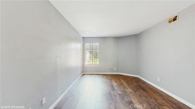 9020 Newport Ave Unit 17, Fontana, CA 92335 - spare room with wood finished floors and baseboards