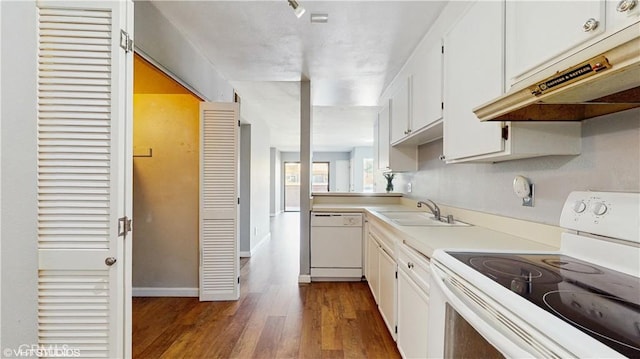 9020 Newport Ave Unit 17, Fontana, CA 92335 - kitchen featuring white appliances, under cabinet range hood, dark wood-style flooring, light countertops, and white cabinets