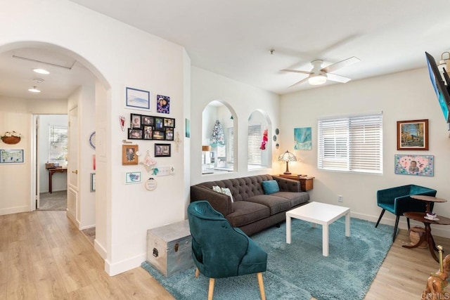 26396 Arboretum Way Unit 2908, Murrieta, CA 92563 - living area featuring light wood finished floors, a ceiling fan, and arched walkways
