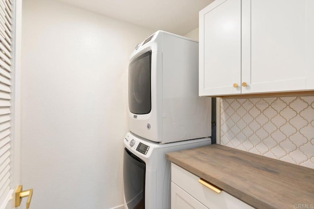 26396 Arboretum Way Unit 2908, Murrieta, CA 92563 - laundry room with stacked washing machine and dryer and cabinet space