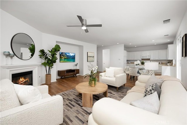 154 Fernpine Ln, Pomona, CA 91767 - living area featuring light wood-style flooring, a ceiling fan, recessed lighting, and a glass covered fireplace