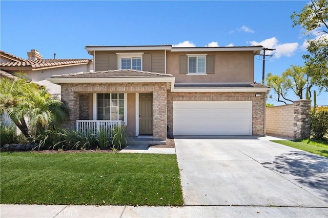 154 Fernpine Ln, Pomona, CA 91767 - view of front of home featuring covered porch, an attached garage, driveway, a front yard, and stucco siding