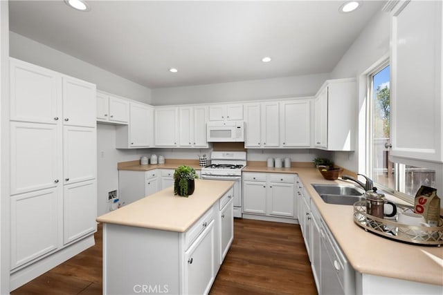 154 Fernpine Ln, Pomona, CA 91767 - kitchen featuring white appliances, white cabinets, light countertops, and recessed lighting