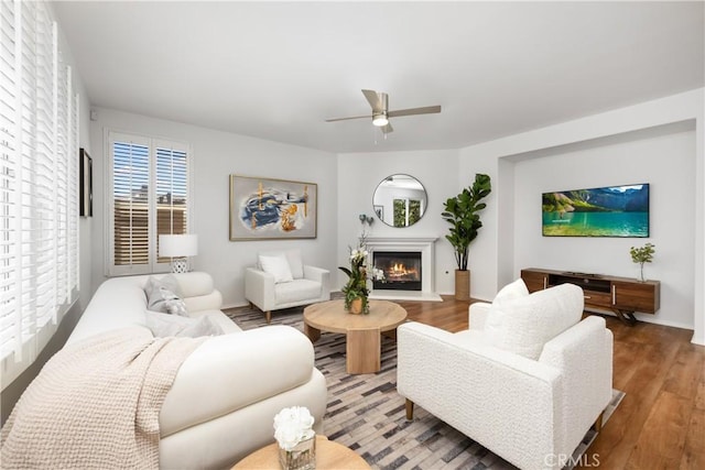 154 Fernpine Ln, Pomona, CA 91767 - living room featuring ceiling fan, wood finished floors, and a glass covered fireplace