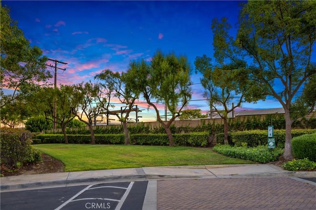 154 Fernpine Ln, Pomona, CA 91767 - yard at dusk featuring a lawn