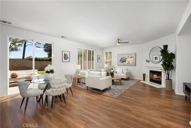154 Fernpine Ln, Pomona, CA 91767 - living area with wood finished floors, a glass covered fireplace, and a ceiling fan