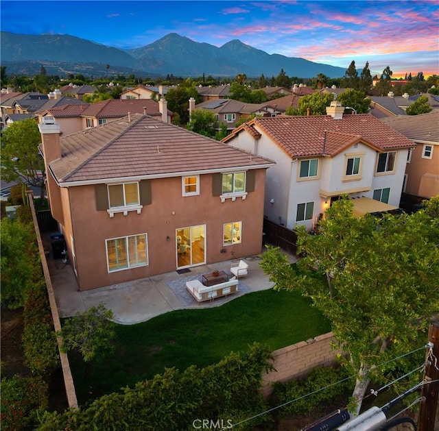154 Fernpine Ln, Pomona, CA 91767 - back of house featuring a chimney, stucco siding, a patio, a fenced backyard, and a residential view