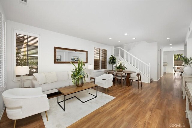 154 Fernpine Ln, Pomona, CA 91767 - living area with stairs, light wood finished floors, and recessed lighting