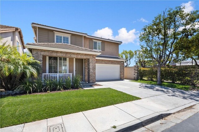 154 Fernpine Ln, Pomona, CA 91767 - traditional home featuring a porch, driveway, a garage, a front lawn, and brick siding