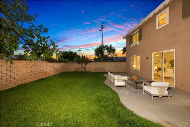154 Fernpine Ln, Pomona, CA 91767 - yard at dusk with a fenced backyard, a patio, and outdoor lounge area