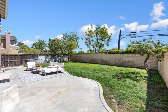 154 Fernpine Ln, Pomona, CA 91767 - fenced backyard featuring a patio area and outdoor lounge area