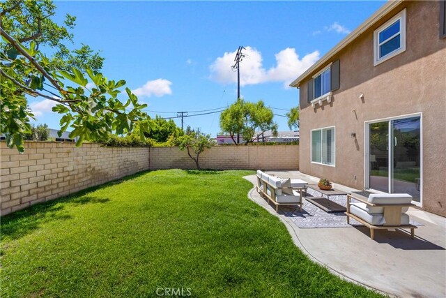 154 Fernpine Ln, Pomona, CA 91767 - fenced backyard with a patio area and an outdoor hangout area