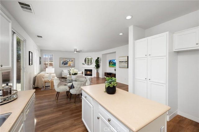 154 Fernpine Ln, Pomona, CA 91767 - kitchen featuring a lit fireplace, dark wood-style floors, open floor plan, light countertops, and recessed lighting