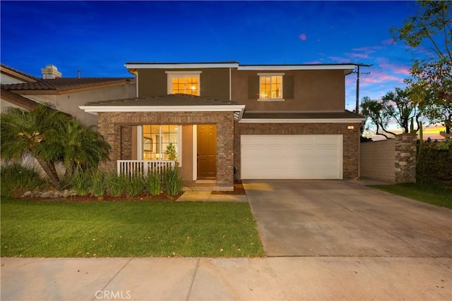 154 Fernpine Ln, Pomona, CA 91767 - traditional-style home with a garage, stucco siding, a porch, driveway, and a front yard