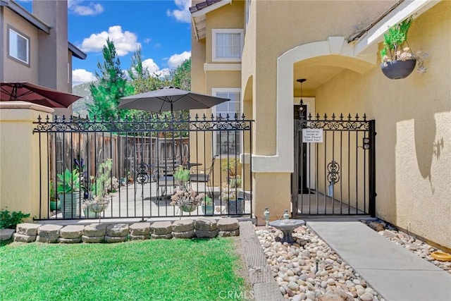 30747 Loma Linda Rd, Temecula, CA 92592 - view of exterior entry with a gate and stucco siding