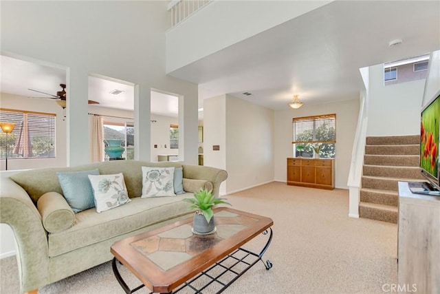 30747 Loma Linda Rd, Temecula, CA 92592 - living area with light carpet, stairs, and a ceiling fan