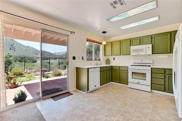 30747 Loma Linda Rd, Temecula, CA 92592 - kitchen featuring green cabinetry, white appliances, light countertops, and hanging light fixtures