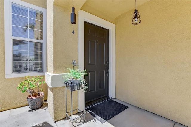 30747 Loma Linda Rd, Temecula, CA 92592 - view of exterior entry with stucco siding and covered porch