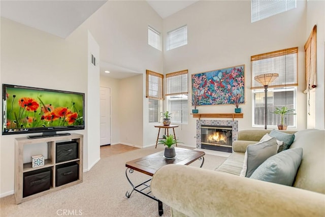 30747 Loma Linda Rd, Temecula, CA 92592 - carpeted living area with healthy amount of natural light, a tile fireplace, and a towering ceiling