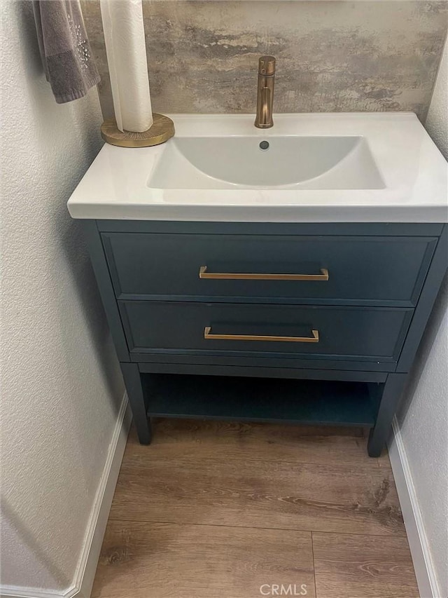 2000 San Antonio Dr, Corona, Corona, CA 92882 - bathroom view of wood finished floors, vanity, and a textured wall