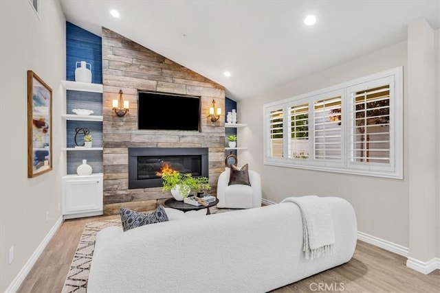 33554 Halyard Dr, Dana Point, CA 92629 - living area with lofted ceiling, wood finished floors, a fireplace, and recessed lighting