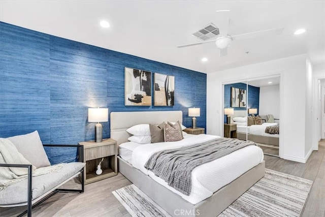 33554 Halyard Dr, Dana Point, CA 92629 - bedroom featuring an accent wall, a closet, recessed lighting, wood finished floors, and ceiling fan