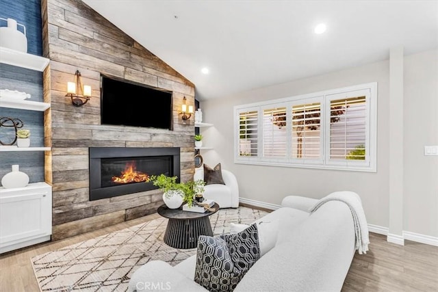 33554 Halyard Dr, Dana Point, CA 92629 - living room with a fireplace, lofted ceiling, wood finished floors, and recessed lighting