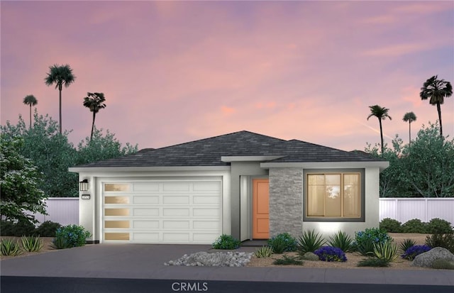 73782 Julie Ln, Palm Desert, CA 92211 - view of front of property featuring concrete driveway, a garage, stucco siding, and roof with shingles