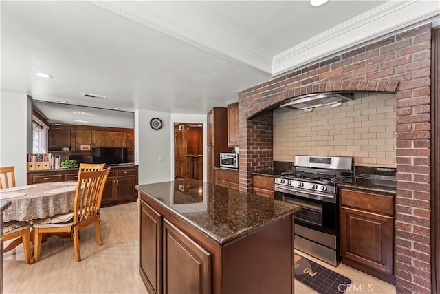 1825 Calle Madrid, Rowland Heights, CA 91748 - kitchen featuring gas range, tasteful backsplash, crown molding, a center island, and dark stone counters