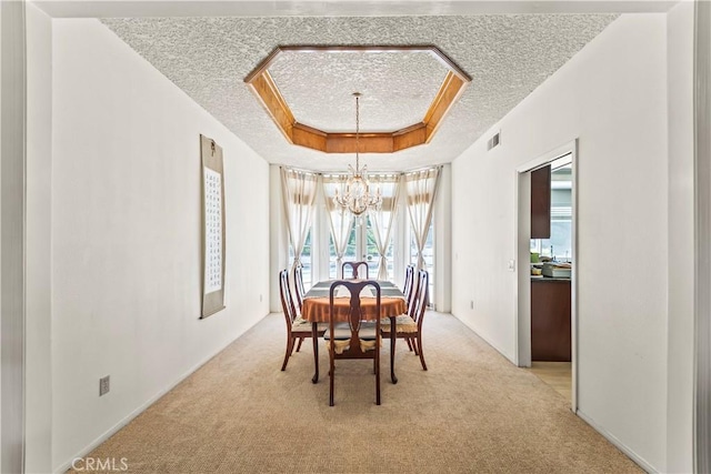 1825 Calle Madrid, Rowland Heights, CA 91748 - dining area with a chandelier, a textured ceiling, light colored carpet, and a raised ceiling