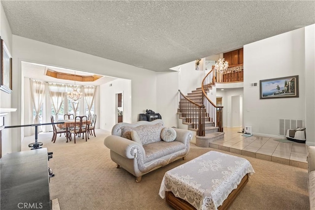 1825 Calle Madrid, Rowland Heights, CA 91748 - living area featuring a chandelier, carpet flooring, stairway, a textured ceiling, and tile patterned flooring