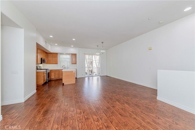 2245 Chaffee St, Fullerton, CA 92833 - unfurnished living room with dark wood finished floors, a chandelier, and recessed lighting