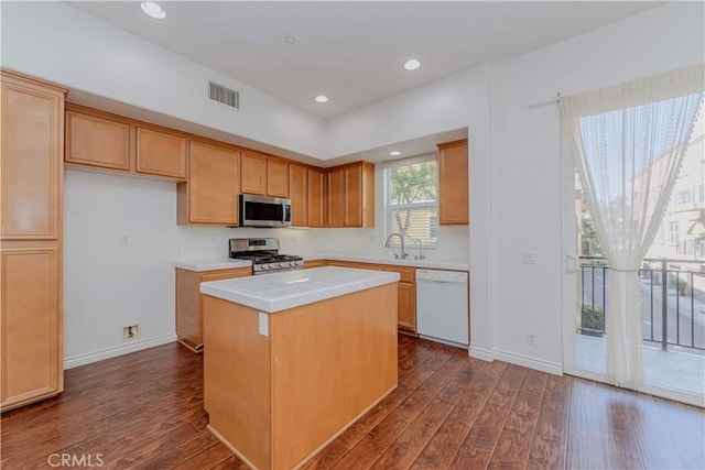 2245 Chaffee St, Fullerton, CA 92833 - kitchen featuring appliances with stainless steel finishes, dark wood-style flooring, a kitchen island, light countertops, and recessed lighting