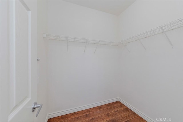 2245 Chaffee St, Fullerton, CA 92833 - spacious closet featuring dark wood-style floors