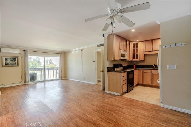1620 Neil Armstrong St Unit 306, Montebello, CA 90640 - kitchen with black electric range, white microwave, dark countertops, glass insert cabinets, and light wood finished floors