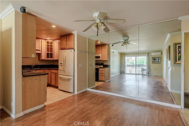 1620 Neil Armstrong St Unit 306, Montebello, CA 90640 - kitchen with white appliances, ornamental molding, a ceiling fan, dark countertops, and light wood-style floors