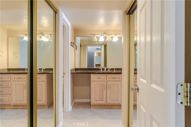 1620 Neil Armstrong St Unit 306, Montebello, CA 90640 - bathroom with vanity and tile patterned flooring
