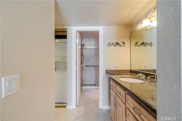 1620 Neil Armstrong St Unit 306, Montebello, CA 90640 - full bathroom featuring tile patterned floors, vanity, and a shower stall