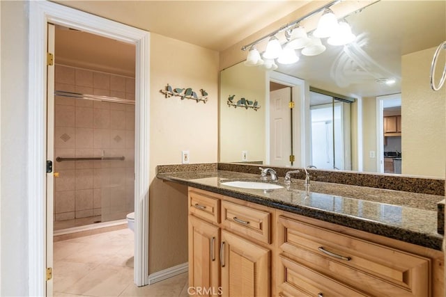 1620 Neil Armstrong St Unit 306, Montebello, CA 90640 - full bath featuring vanity, a shower stall, and tile patterned flooring