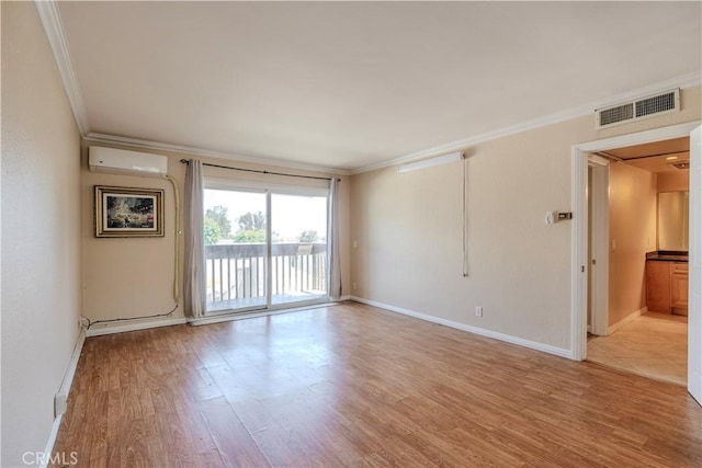 1620 Neil Armstrong St Unit 306, Montebello, CA 90640 - unfurnished room with crown molding, a wall mounted AC, and light wood-style floors