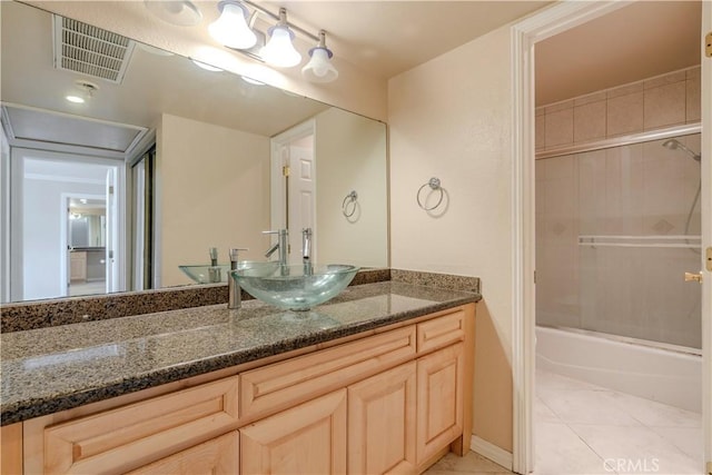 1620 Neil Armstrong St Unit 306, Montebello, CA 90640 - bathroom featuring vanity, tile patterned flooring, and washtub / shower combination