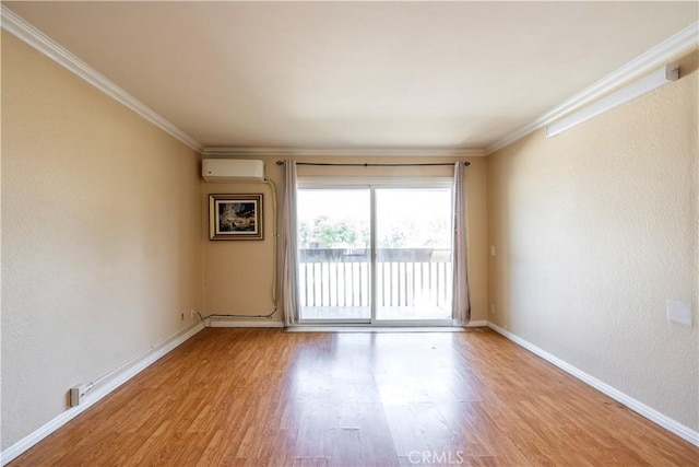1620 Neil Armstrong St Unit 306, Montebello, CA 90640 - spare room with an AC wall unit, light wood finished floors, and ornamental molding