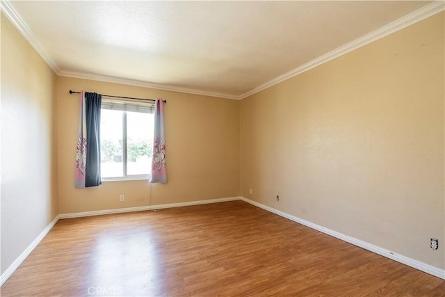 1620 Neil Armstrong St Unit 306, Montebello, CA 90640 - spare room featuring light wood finished floors and crown molding