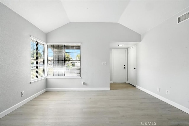 10655 Springfield Dr, Rancho Cucamonga, CA 91730 - spare room featuring light wood-style flooring and vaulted ceiling