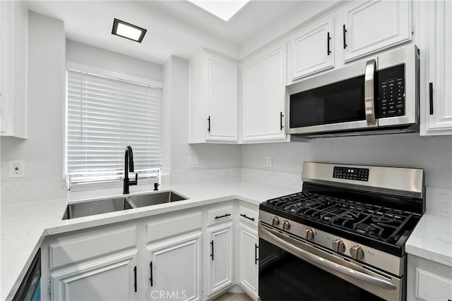 10655 Springfield Dr, Rancho Cucamonga, CA 91730 - kitchen with appliances with stainless steel finishes, white cabinets, and light stone counters
