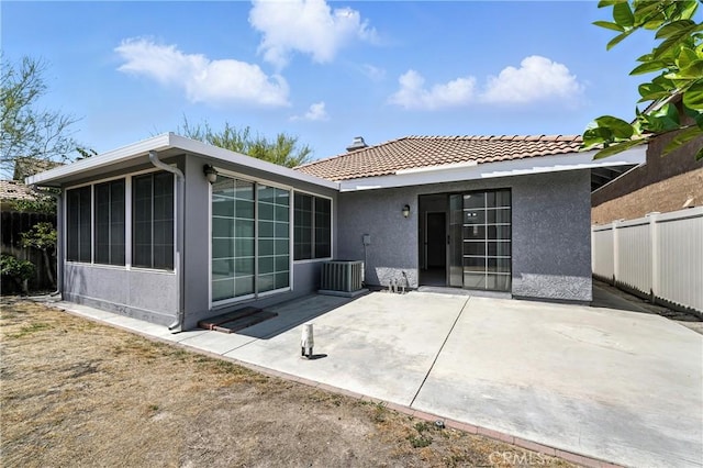 10655 Springfield Dr, Rancho Cucamonga, CA 91730 - rear view of house with stucco siding, a patio, a tiled roof, and a sunroom