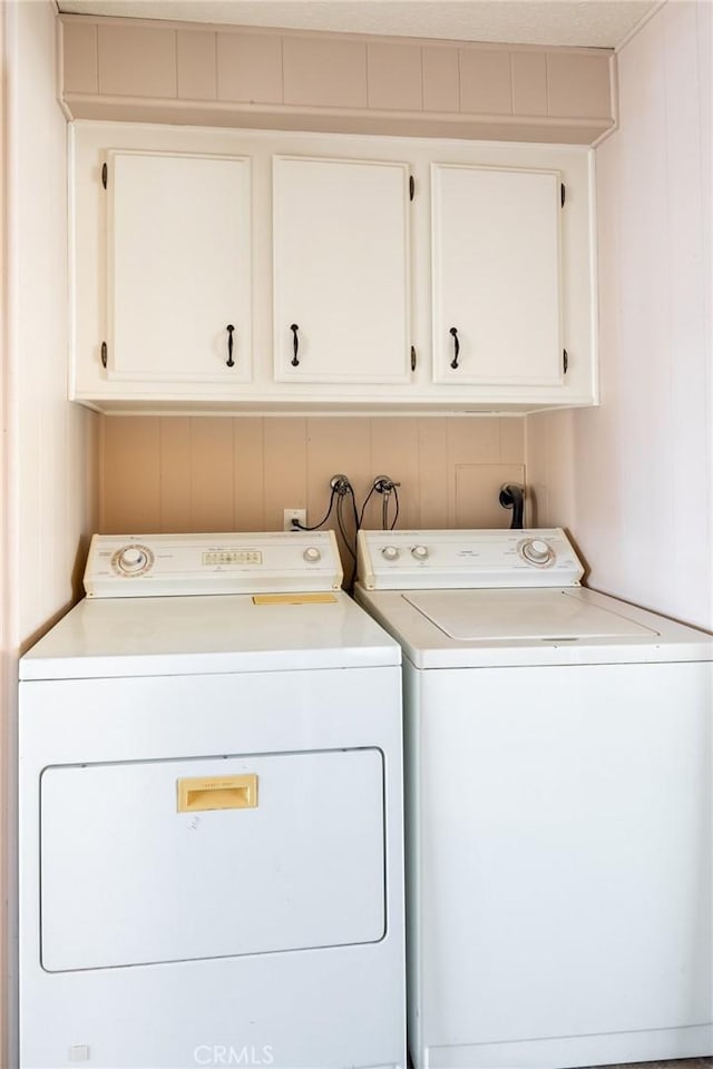 32540 San Miguelito Dr, Thousand Palms, CA 92276 - laundry area with cabinet space and washing machine and clothes dryer
