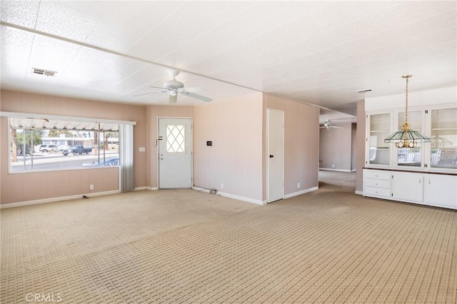 32540 San Miguelito Dr, Thousand Palms, CA 92276 - unfurnished living room featuring ceiling fan and light carpet